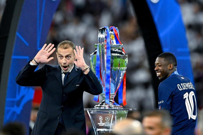 El presidente de la UEFA Aleksander Ceferin (I) y Ousmane Dembele, del PSG, tras la final de la Liga de Campeones UEFA entre Paris Saint-Germain y Arsenal en el estadio Puskas Arena en Budapest, HungríaEFE/EPA/Robert Hegedus
