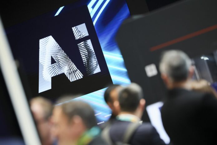 Imagen de archivo de un logo de IA en una feria tecnológica. EFE/EPA/HANNIBAL HANSCHKE
