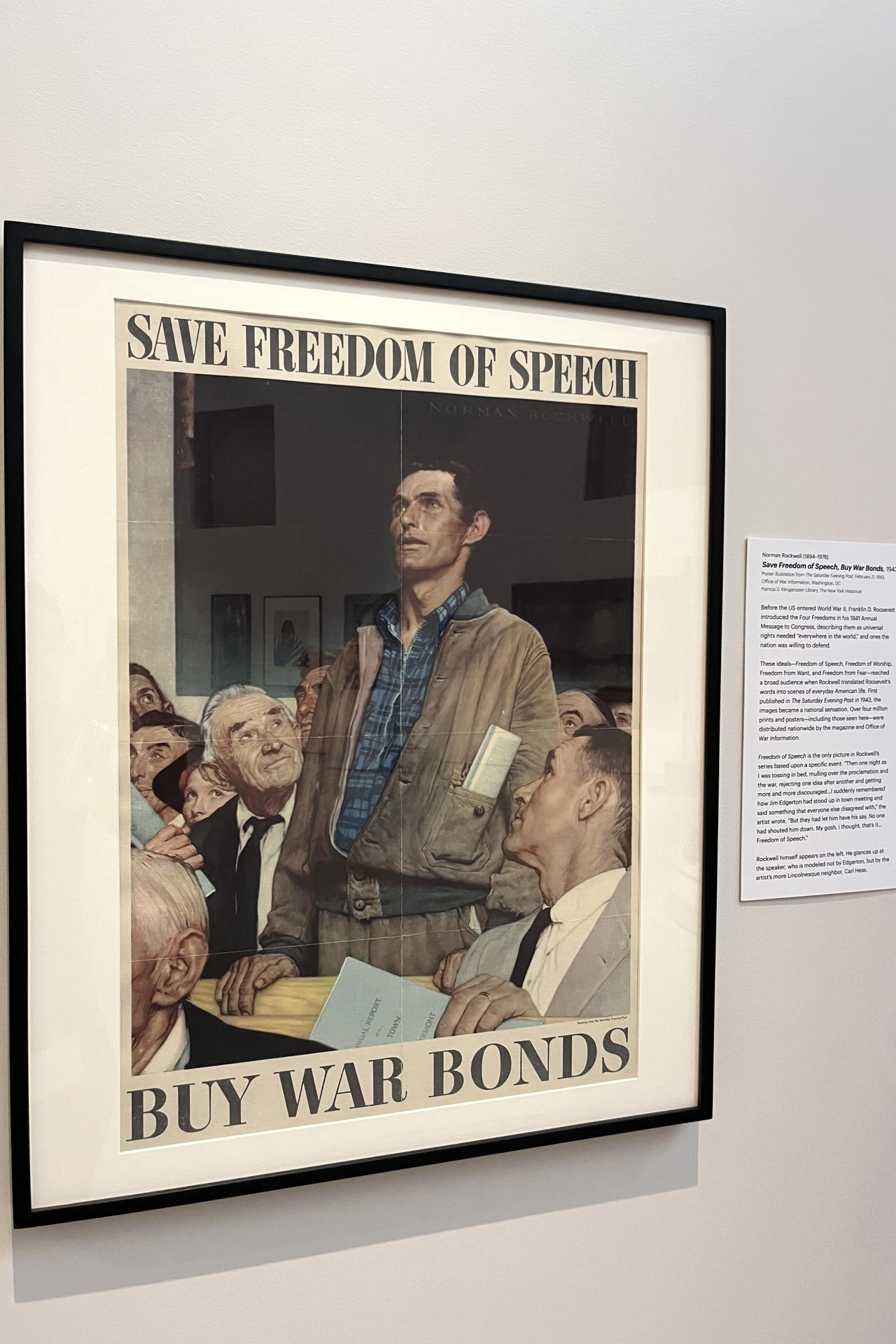 Fotografía que muestra un póster religioso de la Segunda Guerra Mundial de Norman Rockwell con el mensaje 'Save Freedom of Worship. Buy War Bonds' (Salve la libertad de culto. Compre bonos de guerra) durante la exposición 'Democracy Matters' este martes, en el museo New York Historical de Nueva York (Estados Unidos). EFE/ Nora Quintanilla
